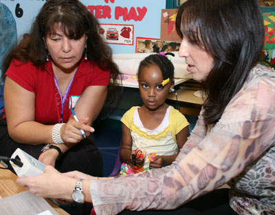 a child participating in a hearing screening