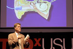 Dr. Karl White at TEDxUSU giving a talk on newborn hearing screening