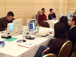 onsite instruction, participants working on audiological equipment