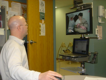 an audiologist conducting a teleaudiology session