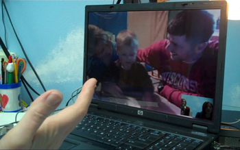 a TI session in progress, a family displayed on a laptop
